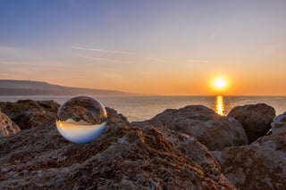 Sunrise-and-a-glass-ball-near-the-sea-854619484_4429x2952.jpeg