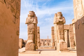 egyptian-statues-temple-ruins-ss_531850732.jpeg